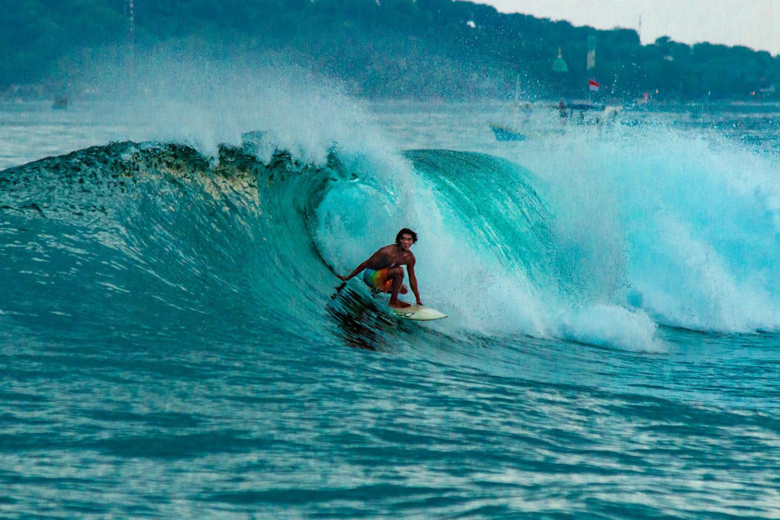 Turquoise bay and dry headland on the Sumbawa coast