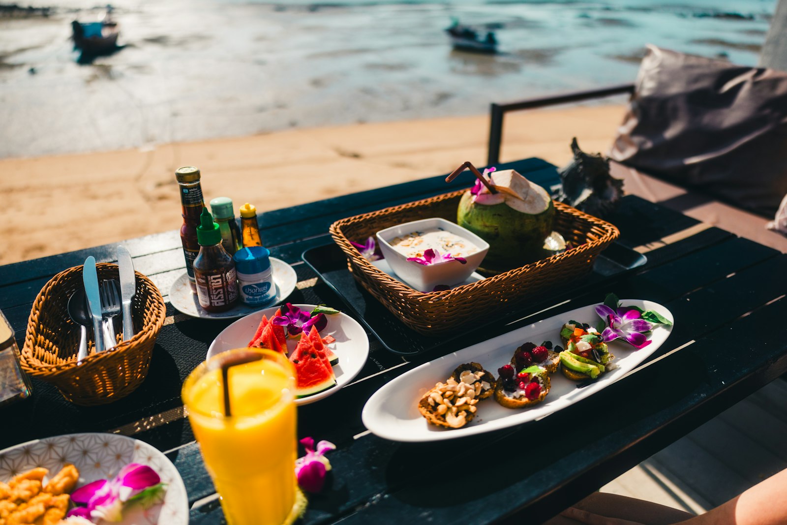 Delicious food and drinks are ready on the beach.